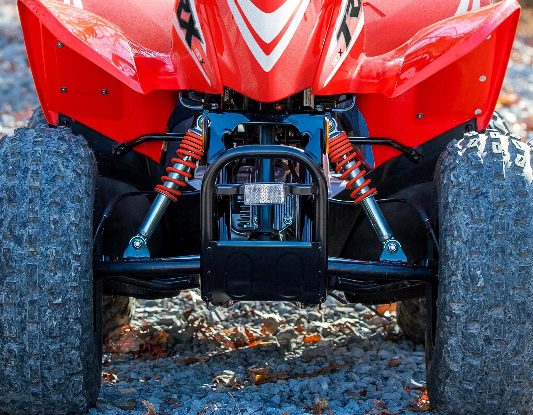 Bump-absorbing front suspension